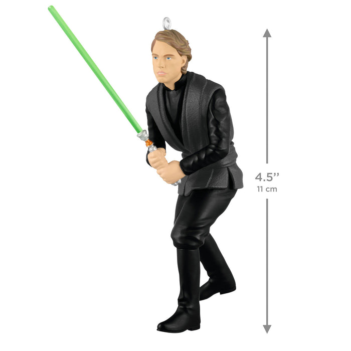 Figure of a character from Star Wars holding a green lightsaber with dimensions indicated.