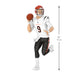 Football player figurine with measurements on a white background