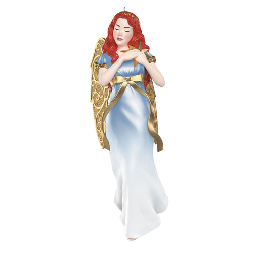 Decorative angel of a woman with red hair and a gold and blue dress on a white background