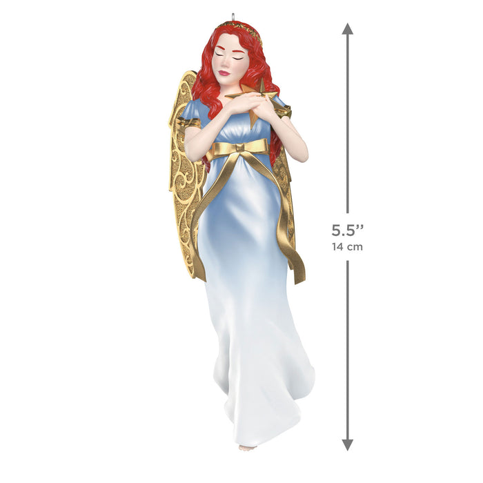 Decorative angel ornament with red hair and gold wings, standing on a white background with measurement label.
