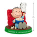 Figurine of a character watching TV with a dog, sitting on a red chair, holding popcorn, with a measurement label at the bottom.