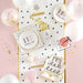 Decorative birthday cards with polka dots and confetti on a pink background