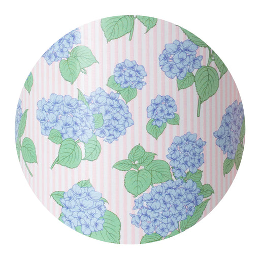 Round mat with blue hydrangea flowers and green leaves on a pink striped background
