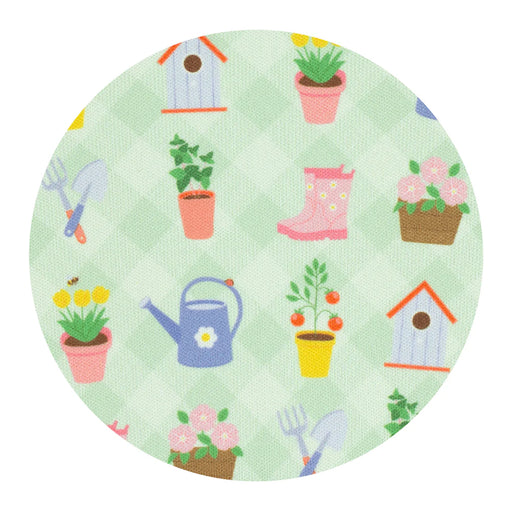 Round fabric swatch with gardening-themed pattern on a light green background