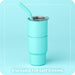 Turquoise tumbler with a straw on a light blue background