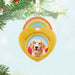Heart-shaped ornament with a dog photo and 'In Our Hearts to Stay' text, hanging on a Christmas tree.