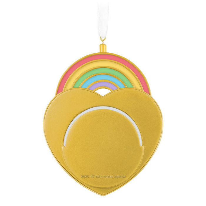 Heart-shaped ornament with rainbow design on a white background