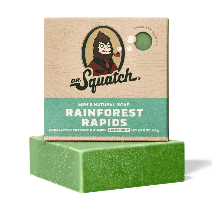Green bar of soap with Dr. Squatch packaging on a white background