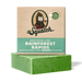 Green bar of soap with Dr. Squatch packaging on a white background