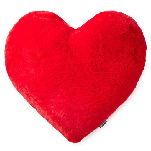 Red heart-shaped pillow on a white background