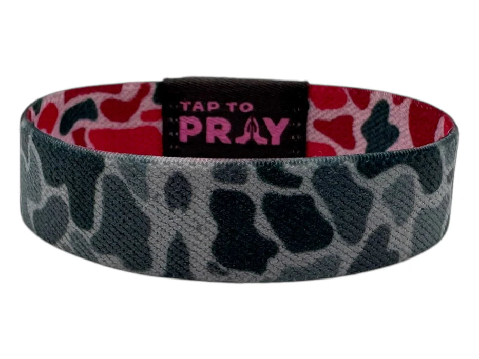 Camouflage-patterned wristband with 'Tap to Pray' label on a white background