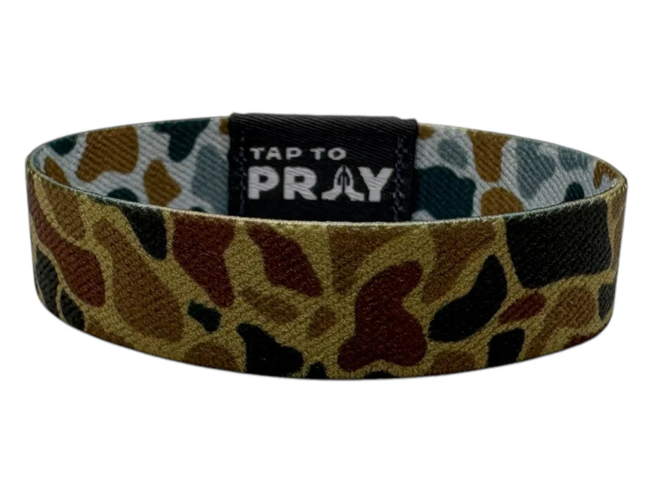 Camouflage-patterned wristband with 'Tap to Pray' label on a white background