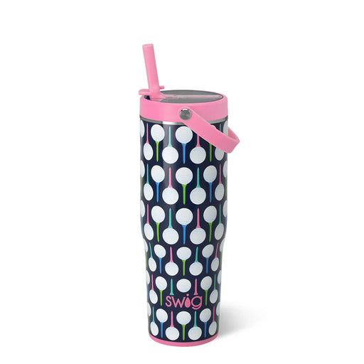 Tumbler with polka dot design and pink straw on a white background