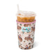 Swig tumbler with cowboy pattern filled with iced coffee on a white background