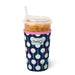 Swig tumbler with polka dot sleeve on a white background