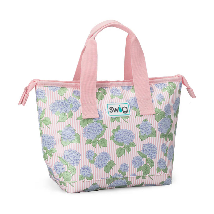Floral patterned tote bag with pink handles on a white background