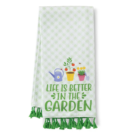 Kitchen towel with garden-themed design and text on a white background
