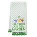Kitchen towel with garden-themed design and text on a white background