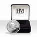 Silver coin with Seattle Seahawks design in a Highland Mint box on a white background
