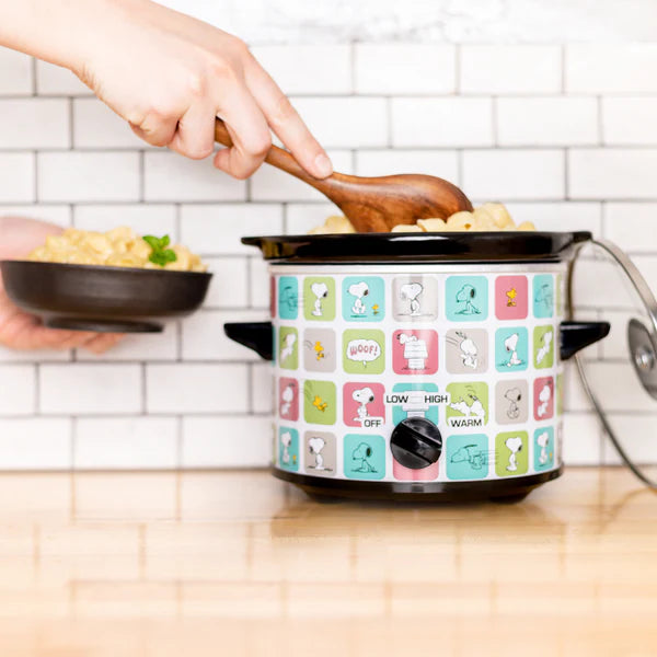 Multicolored electric rice cooker with cartoon designs on a kitchen counter.