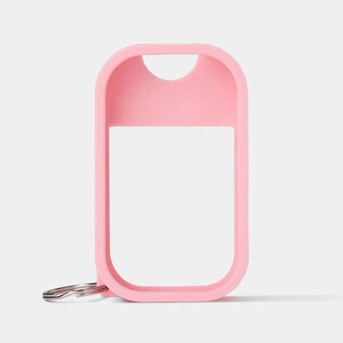 Pink case with a keychain on a light gray background