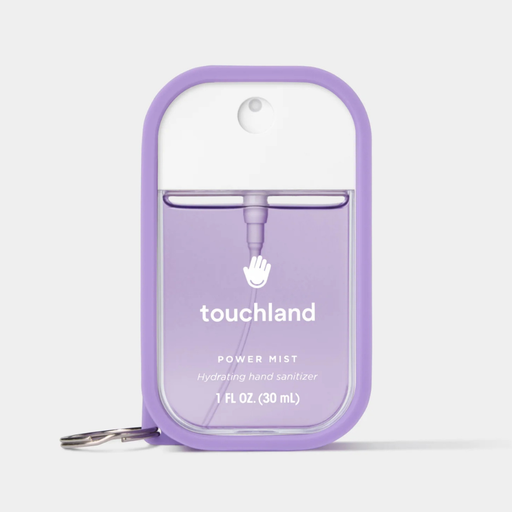A purple and white Touchland Power Mist hand sanitizer bottle with a matching purple protective case and keychain ring, shown on a light gray background.