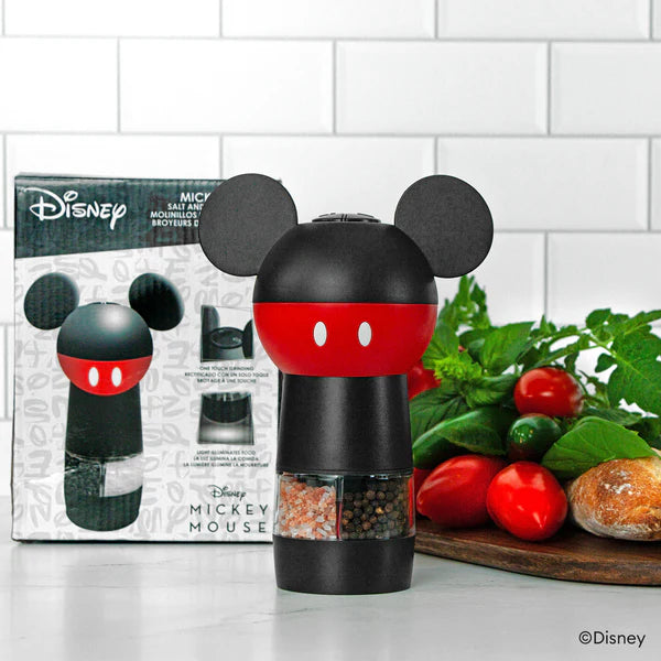 Mickey Mouse salt and pepper shaker set with packaging on a kitchen counter.