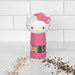 Hello Kitty-themed pink pepper grinder on a white surface with a tiled wall background