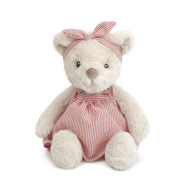 Stuffed teddy bear wearing a red and white striped dress and headband on a white background