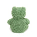 Green plush toy on a white background