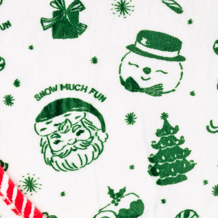White fabric with a green Christmas-themed print featuring Santa Claus, a snowman, a Christmas tree, gift boxes, candy canes, and the phrase 'SNOW MUCH FUN'.