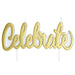 Gold 'Celebrate' candles on white background