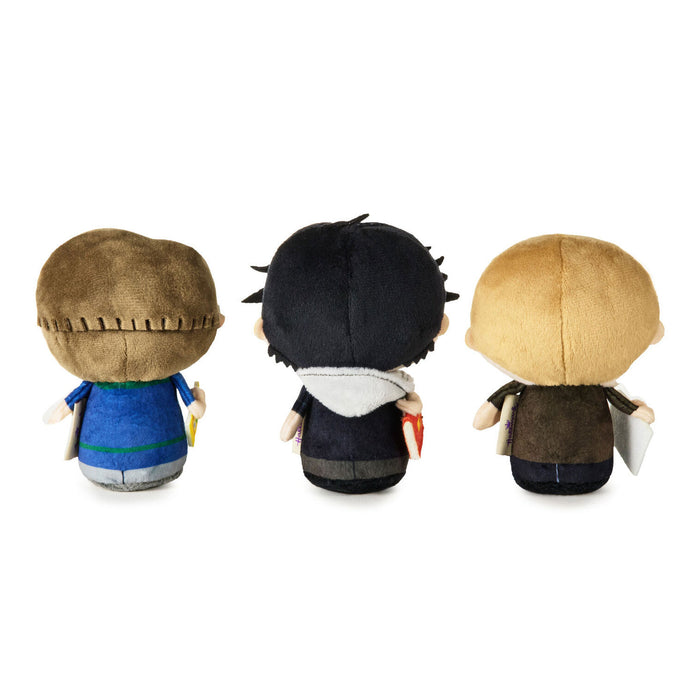 Three small plush character figures shown from the back on a plain white background. Each figure has a rounded head, stitched seam detail, and different colored outfits and hair.