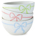 Set of three white bowls with colorful bow designs on a white background