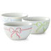 Set of three ceramic bowls with colorful bow designs on a white background