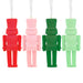 Four colorful toy soldier ornaments in red, pink, green, and light green on a white background.