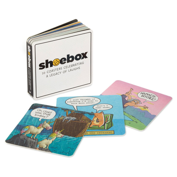 Set of coasters with humorous designs and a 'shoebox' branded box on a white background