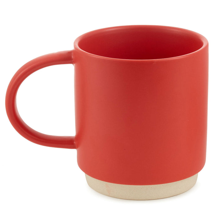 Red mug with a beige base on a white background