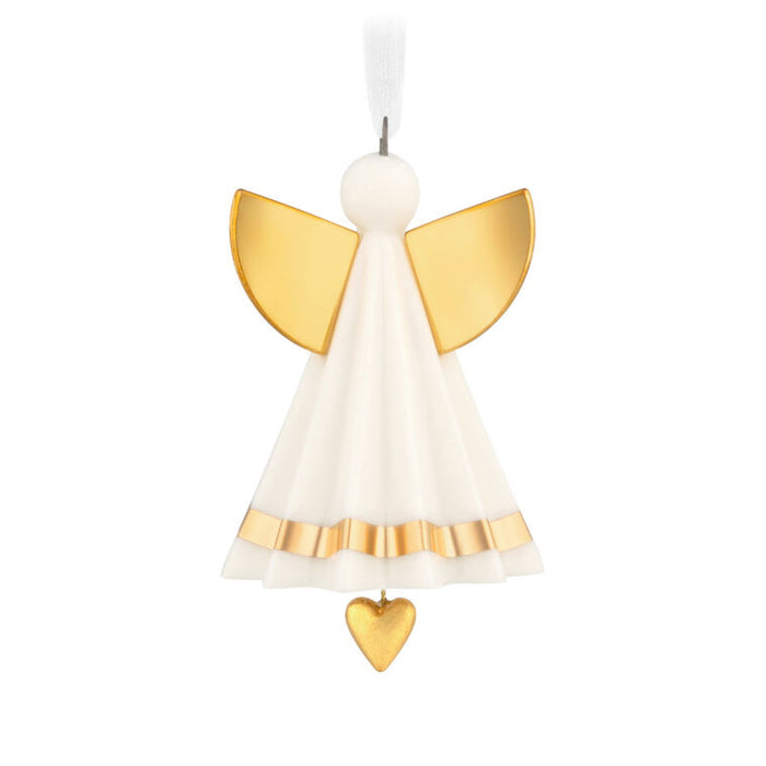 Decorative angel ornament with gold wings and a heart on a white background