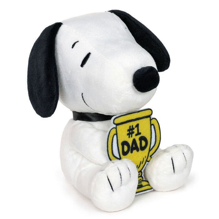 Plush toy of a dog holding a '#1 Dad' mug on a white background