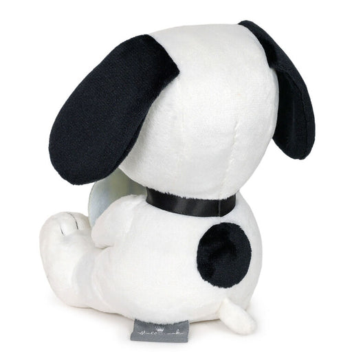 Plush toy resembling a black and white dog with a black collar on a white background