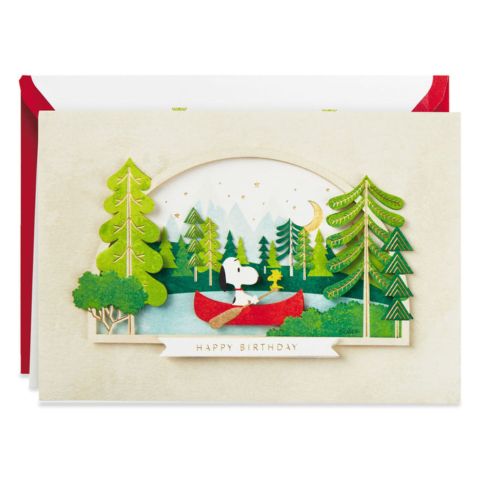 Greeting card with a cartoon character in a red canoe surrounded by trees, with 'Happy Birthday' text.