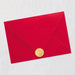 Red envelope with a gold seal on a light gray background