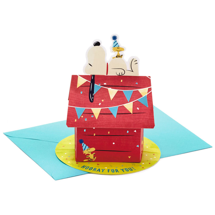 Pop-up card with a doghouse and party animals on a white background