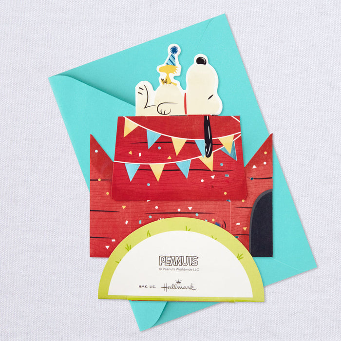 Hallmark Peanuts greeting card with Snoopy on a birthday cake, featuring a blue envelope.