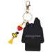 Black Snoopy keychain with colorful charms on a white background