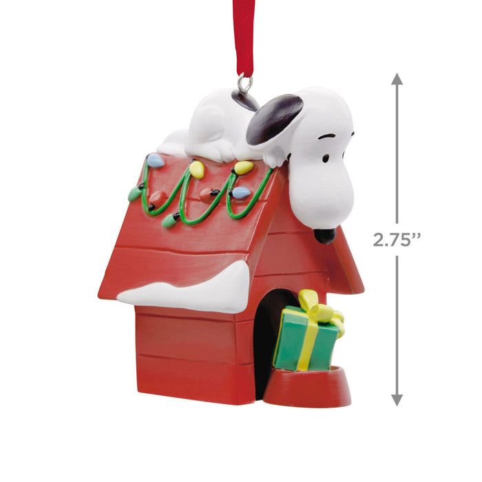 Christmas ornament with a doghouse, Snoopy, and gift box on a white background
