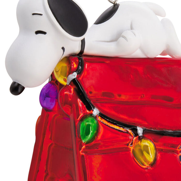 Snoopy character with a red car and colorful lights on a white background