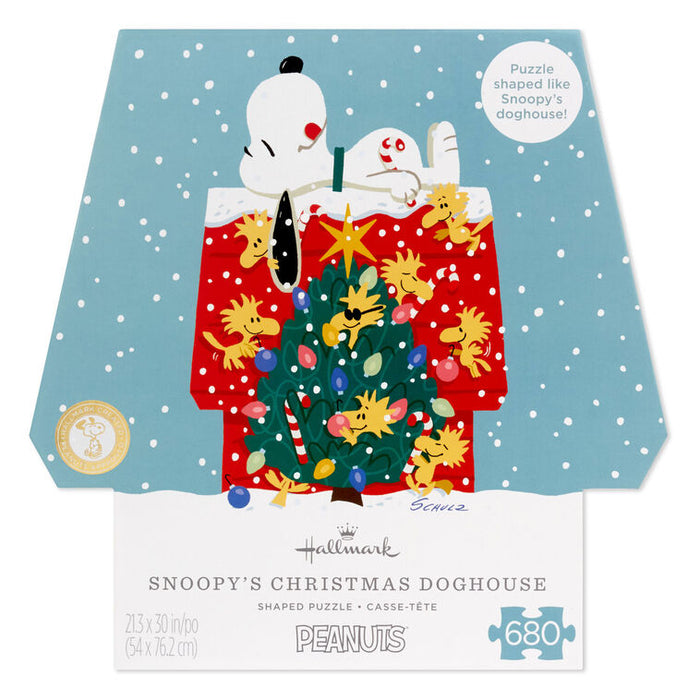 Snoopy Christmas doghouse puzzle packaging with cartoon characters and festive design.