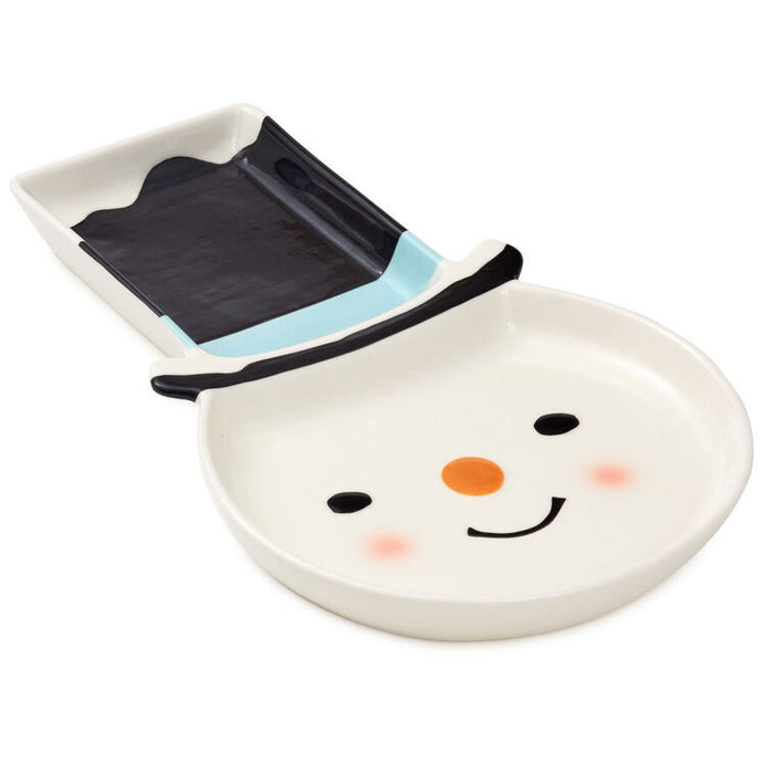 Snowman-shaped plate with a solar panel on a white background